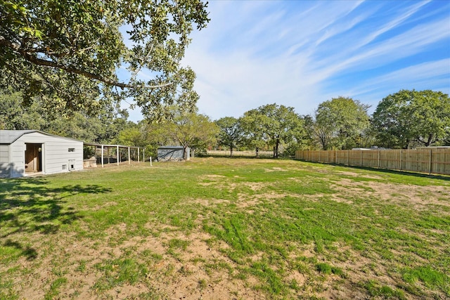 view of yard with a storage unit