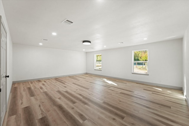 unfurnished room with light hardwood / wood-style flooring