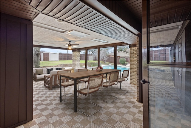 sunroom / solarium featuring wooden ceiling and ceiling fan