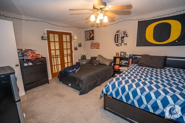 bedroom with a textured ceiling, french doors, carpet, and ceiling fan