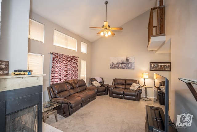 living room with light carpet, high vaulted ceiling, and ceiling fan