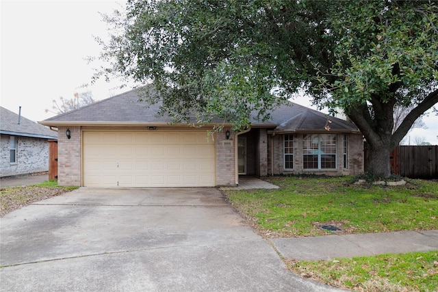 ranch-style house with a front lawn and a garage