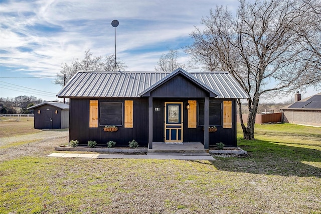 modern farmhouse with a shed and a front yard