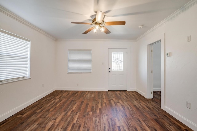 entryway featuring ornamental molding, dark wood-type flooring, and ceiling fan