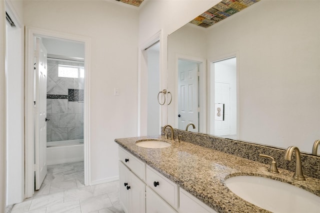 1306 Lexington Sq, Southlake, TX 76092 - full bath with marble look tile flooring, double vanity,  shower combination, and baseboards