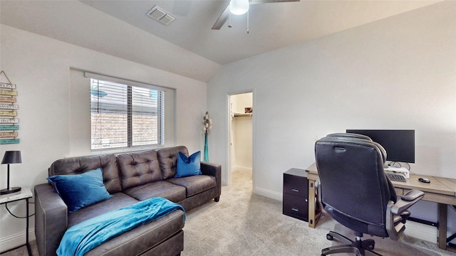 office space featuring light carpet, vaulted ceiling, and ceiling fan