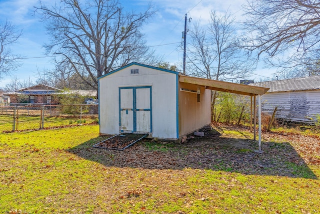 view of outbuilding featuring a yard