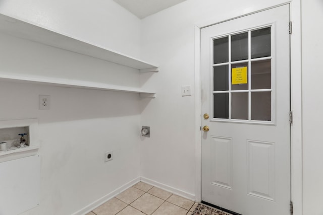 clothes washing area featuring light tile patterned floors, washer hookup, and hookup for an electric dryer