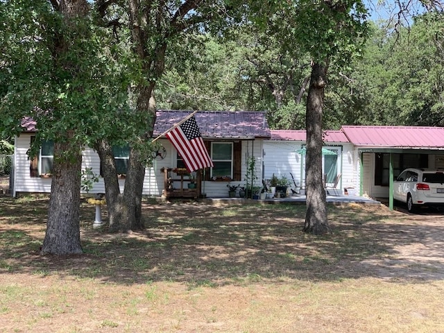 ranch-style house featuring a carport