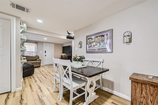 dining space featuring hardwood / wood-style floors