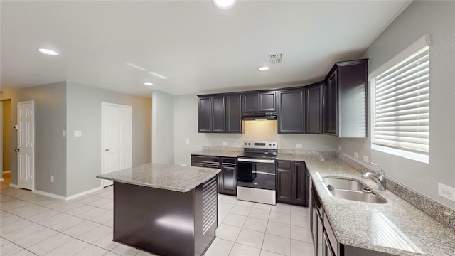 kitchen featuring a sink, under cabinet range hood, a center island, and stainless steel electric stove