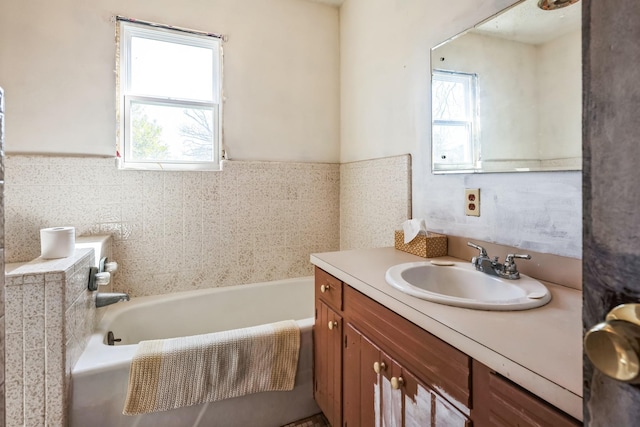 bathroom featuring a bath and vanity