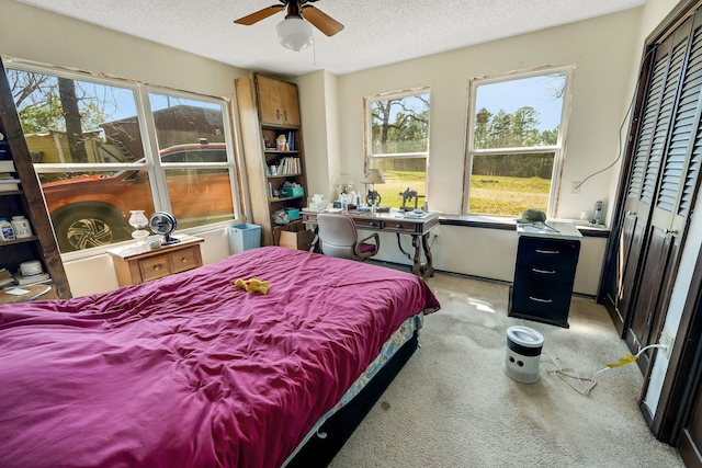 carpeted bedroom with a textured ceiling