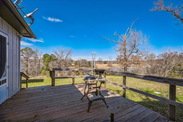 wooden deck with a lawn