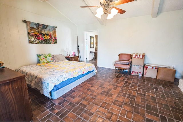 bedroom featuring ceiling fan and vaulted ceiling with beams