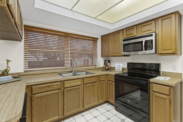 kitchen featuring black electric range and sink