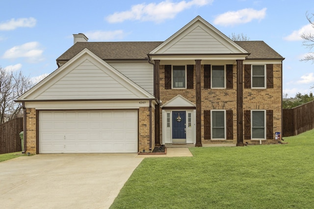 view of front of house featuring a front yard, fence, concrete driveway, a garage, and brick siding