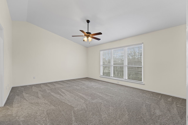 unfurnished room featuring carpet floors, lofted ceiling, and ceiling fan