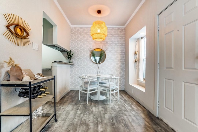 dining area featuring crown molding and dark hardwood / wood-style flooring