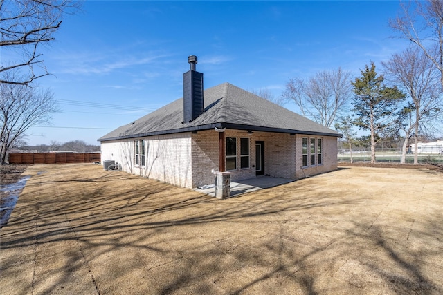 back of property featuring a patio area