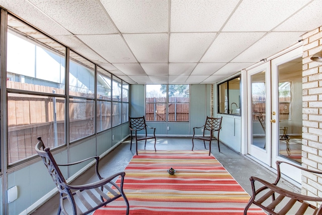 sunroom / solarium with french doors and a drop ceiling