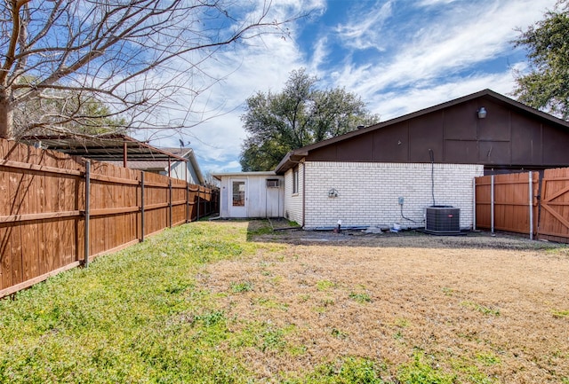 exterior space with a fenced backyard and central air condition unit