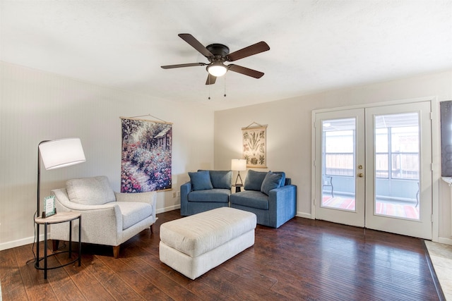 living room with dark wood-style flooring, baseboards, and french doors