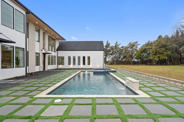 view of swimming pool with an in ground hot tub, a patio, and a yard