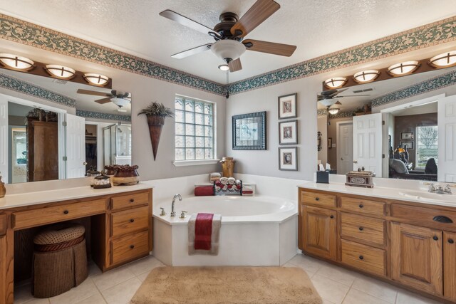 958 Heritage Creek Dr, Rhome, TX 76078 - full bathroom featuring a textured ceiling, ceiling fan, ensuite bathroom, and vanity