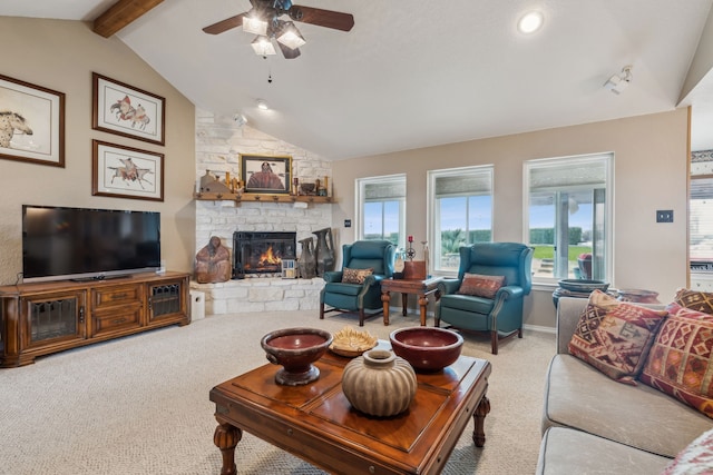 958 Heritage Creek Dr, Rhome, TX 76078 - carpeted living room featuring a fireplace, plenty of natural light, vaulted ceiling with beams, and ceiling fan