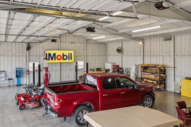 958 Heritage Creek Dr, Rhome, TX 76078 - garage with a garage door opener and metal wall