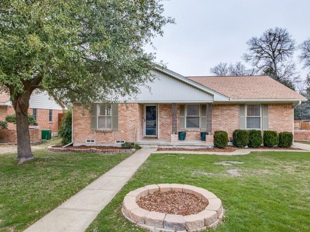 single story home with covered porch and a front lawn