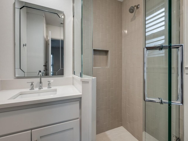 bathroom with an enclosed shower and vanity