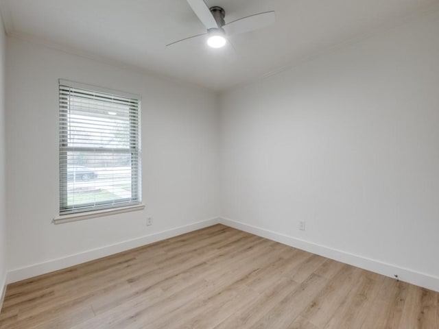 empty room with ornamental molding, ceiling fan, and light hardwood / wood-style floors