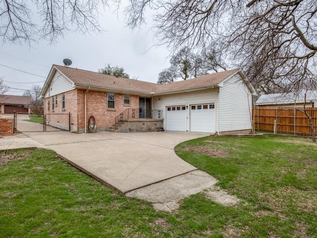 view of front of property with a front lawn and a garage