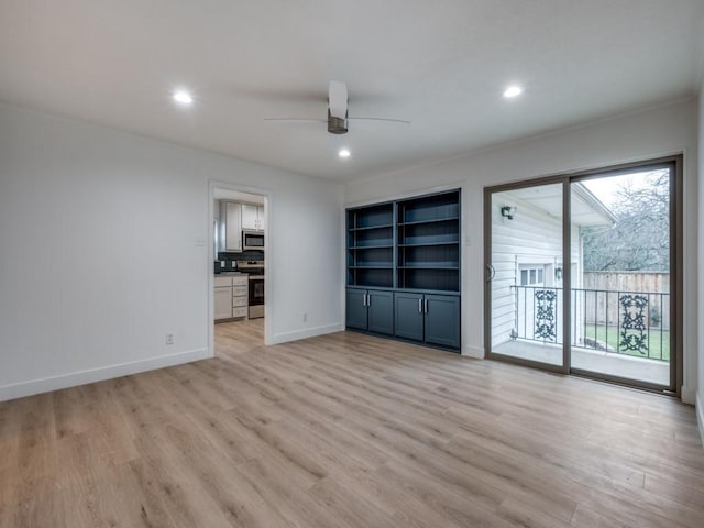 unfurnished room featuring light wood-type flooring and ceiling fan