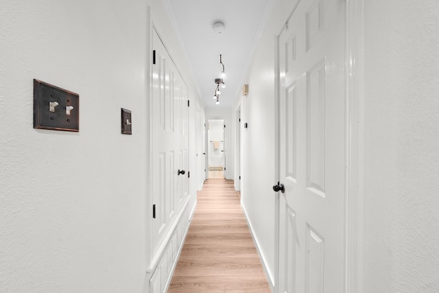 corridor featuring light hardwood / wood-style floors