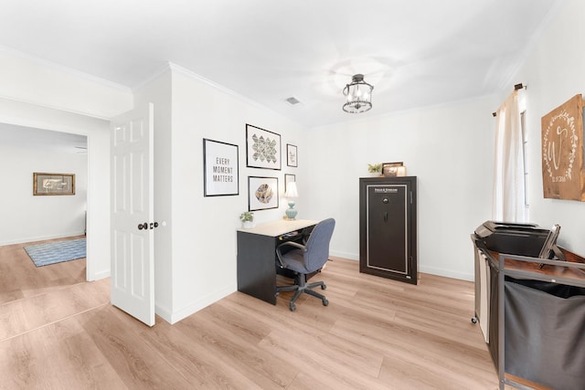 office space with ornamental molding and light wood-type flooring