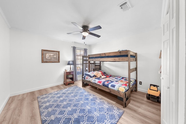 bedroom with ceiling fan and wood-type flooring