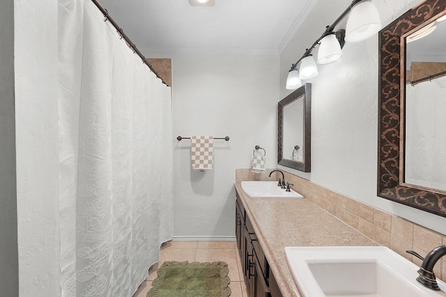 bathroom with vanity, ornamental molding, and tile patterned flooring