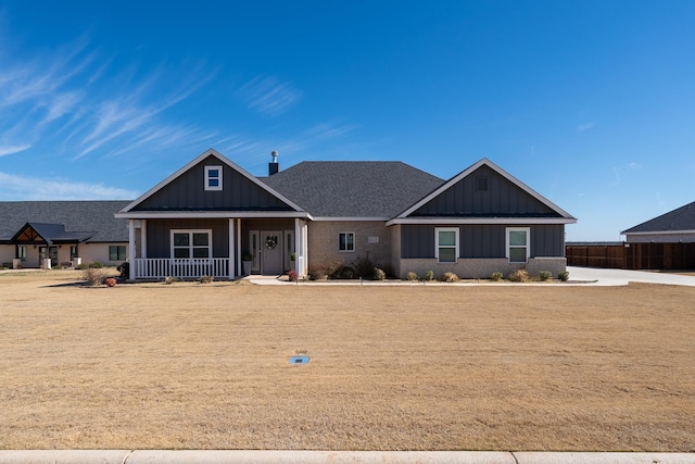 craftsman-style home featuring covered porch and board and batten siding