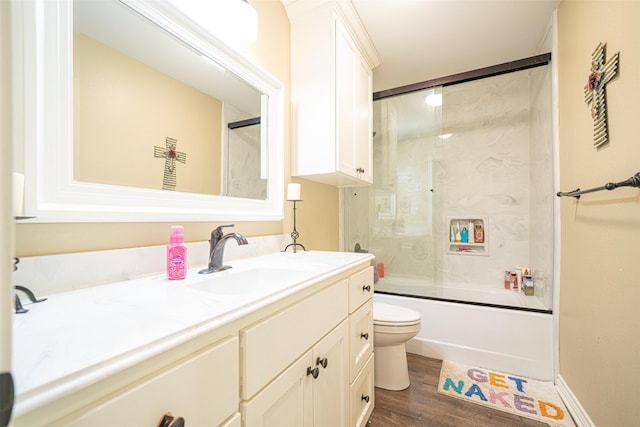 full bathroom with toilet, vanity, combined bath / shower with glass door, and wood-type flooring