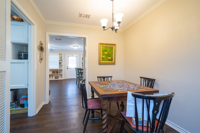 dining space with ornamental molding, a chandelier, and dark hardwood / wood-style flooring