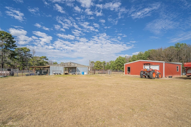 view of yard with an outbuilding