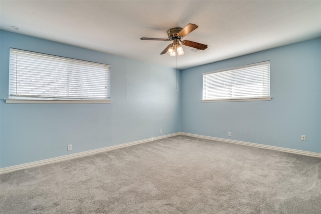 empty room with carpet floors and ceiling fan