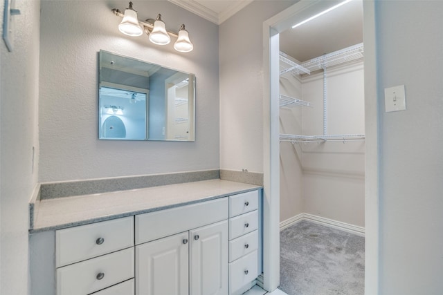 bathroom with vanity and crown molding