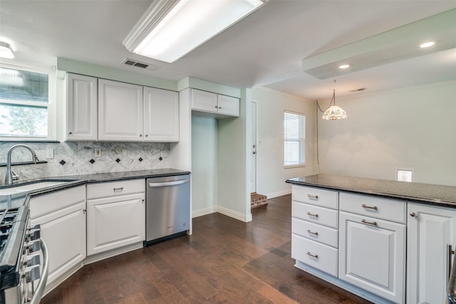 kitchen featuring appliances with stainless steel finishes, sink, and white cabinetry