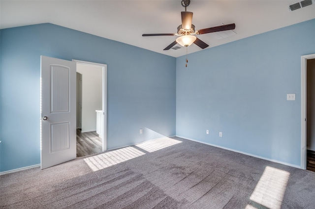 spare room with baseboards, visible vents, ceiling fan, and carpet flooring