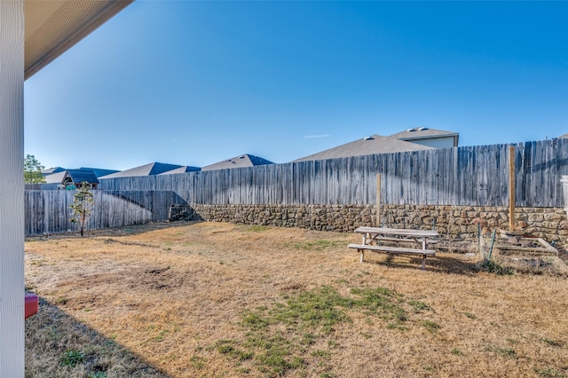 view of yard featuring a fenced backyard