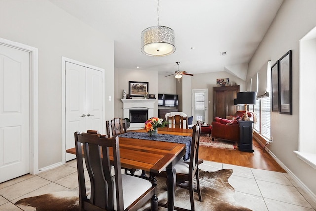 dining area with ceiling fan and light tile patterned floors